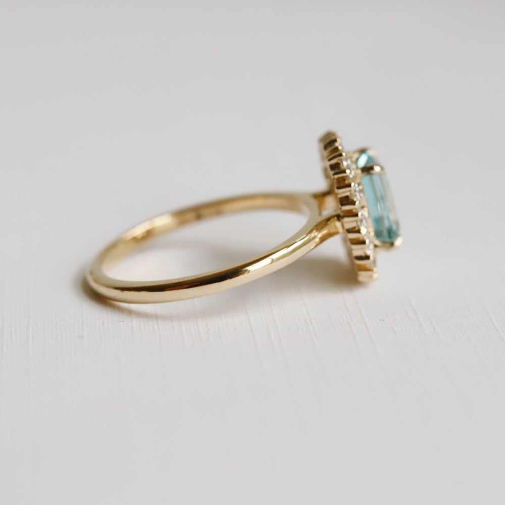 Emma | 1 ct. Emerald Cut Sky Blue Topaz Halo Ring