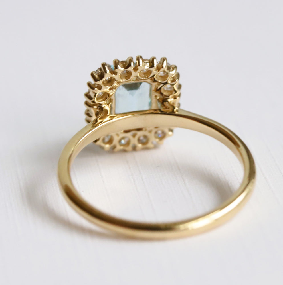 Emma | 1 ct. Emerald Cut Sky Blue Topaz Halo Ring