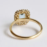 Emma | 1 ct. Emerald Cut Sky Blue Topaz Halo Ring