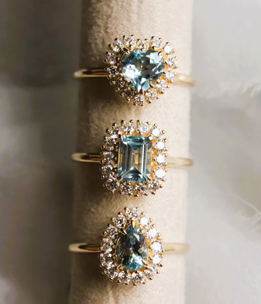 Emma | 1 ct. Emerald Cut Sky Blue Topaz Halo Ring