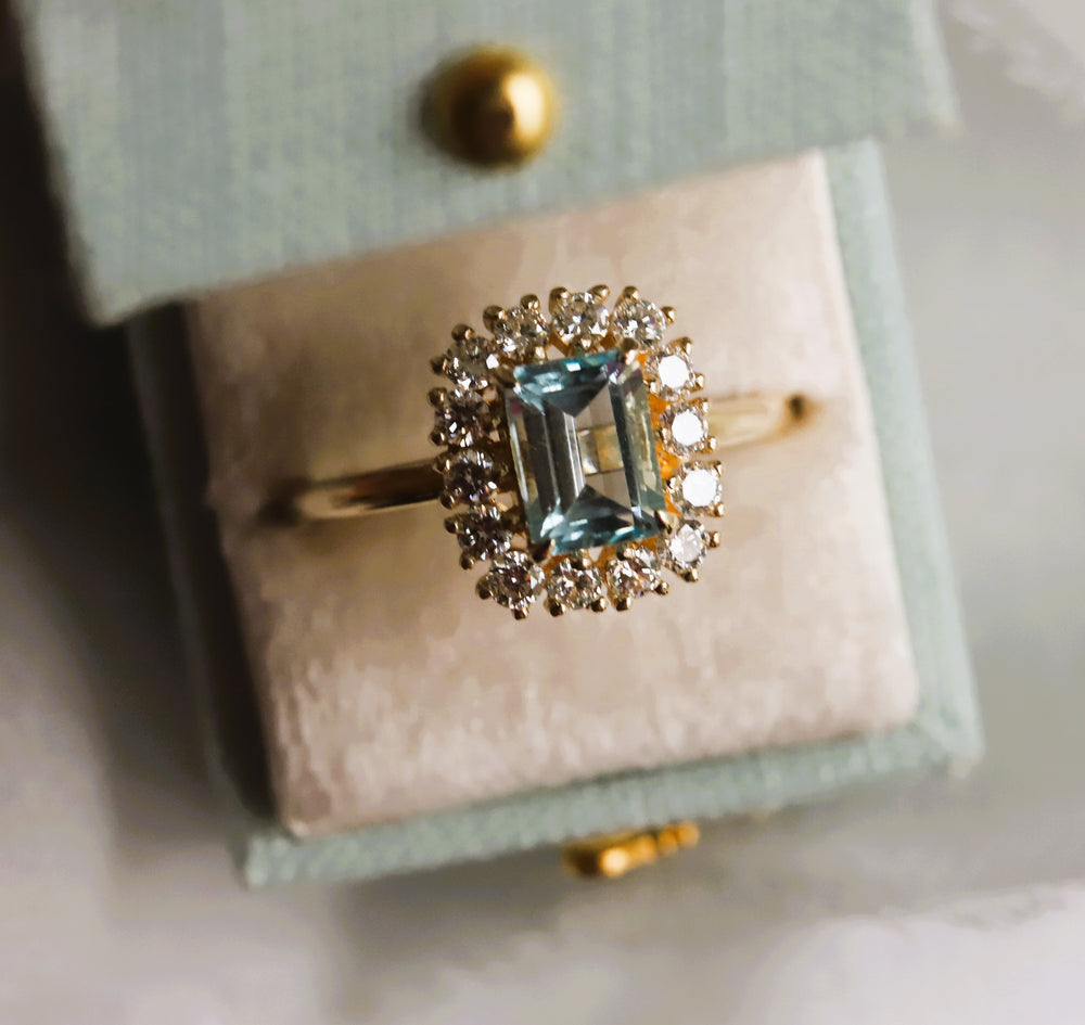 Emma | 1 ct. Emerald Cut Sky Blue Topaz Halo Ring