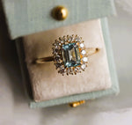 Emma | 1 ct. Emerald Cut Sky Blue Topaz Halo Ring