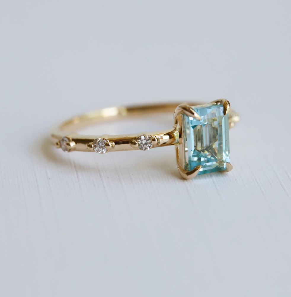 Aurora | 1 ct. Emerald Cut Sky Blue Topaz Accented Ring