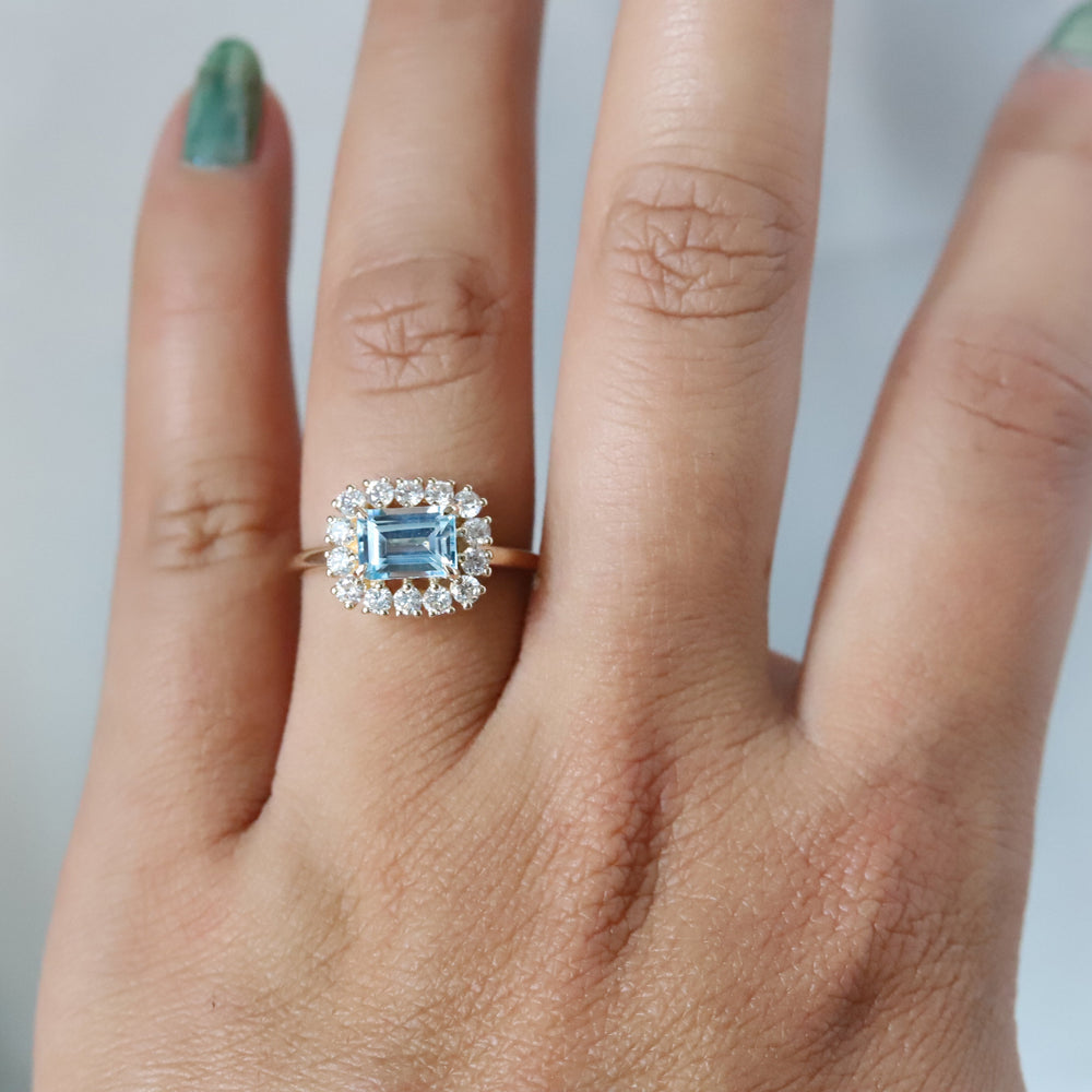 Emma | 1 ct. Emerald Cut Sky Blue Topaz East West Halo Ring