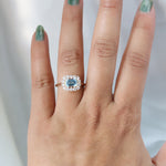 Emma | 1 ct. Emerald Cut Sky Blue Topaz East West Halo Ring