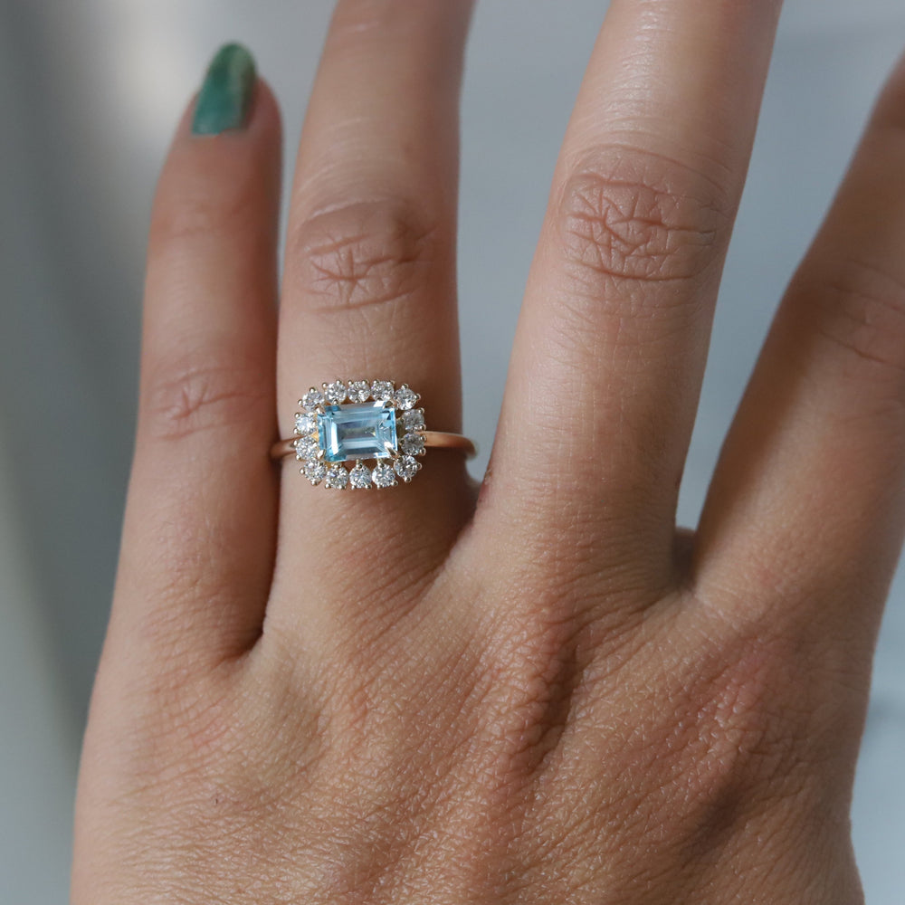 Emma | 1 ct. Emerald Cut Sky Blue Topaz East West Halo Ring