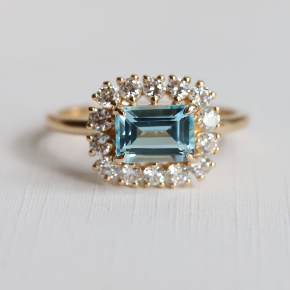 Emma | 1 ct. Emerald Cut Sky Blue Topaz East West Halo Ring