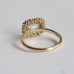 Emma | 1 ct. Emerald Cut Sky Blue Topaz East West Halo Ring