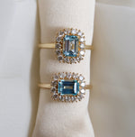 Emma | 1 ct. Emerald Cut Sky Blue Topaz East West Halo Ring