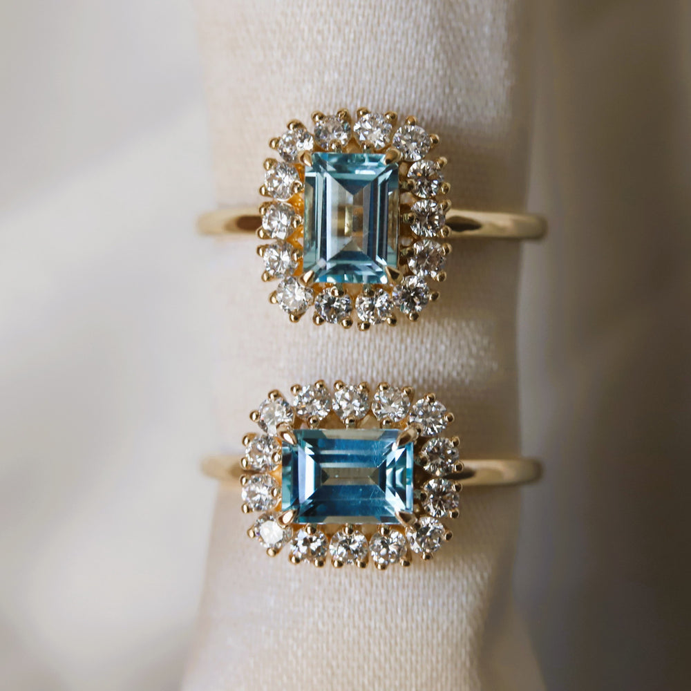 Emma | 1 ct. Emerald Cut Sky Blue Topaz East West Halo Ring