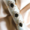 DECORA | Oval Black Center Stone & White Diamond Halo Ring