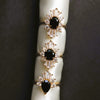 DECORA | Oval Black Center Stone & White Diamond Halo Ring