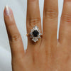 DECORA | Round Black Center Stone & White Diamond Halo Ring