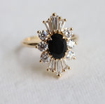DECORA | Oval Black Center Stone & White Diamond Halo Ring