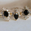 DECORA | Oval Black Center Stone & White Diamond Halo Ring