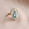 Lana | Pear Sky Blue Topaz Halo Ring