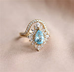 Lana | Pear Sky Blue Topaz Halo Ring